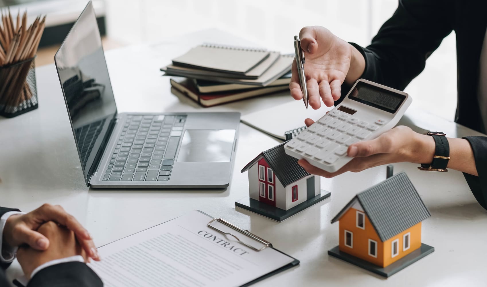 Real estate agent with calculator